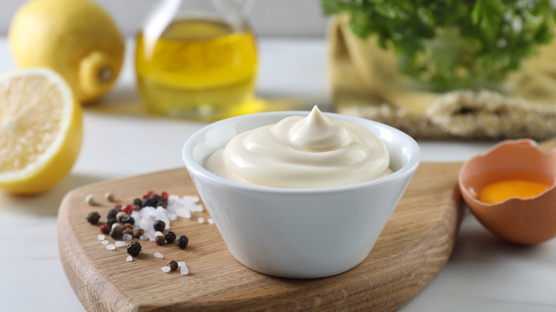 Mayonnaise in a small bowl in front of ingredients