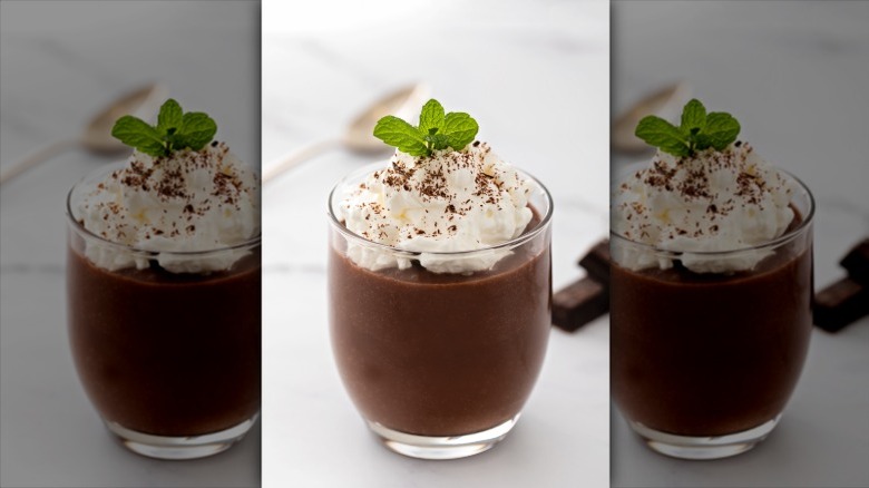 chocolate mousse with whipped cream and chocolate shavings