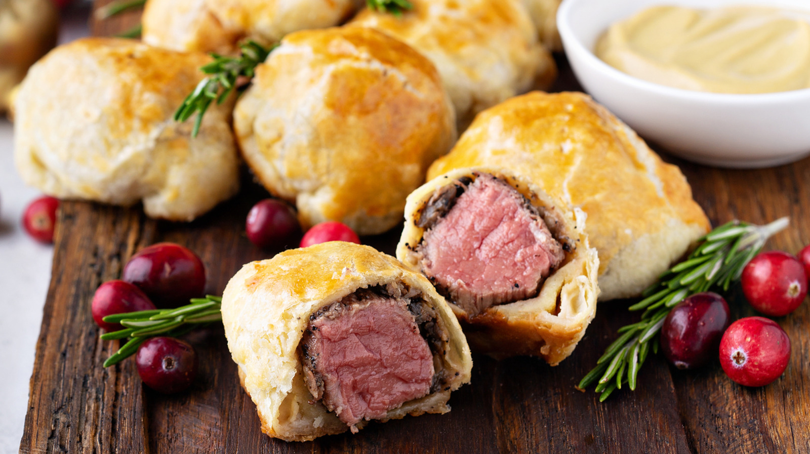 Turn Pigs In A Blanket Into Mini Beef Wellingtons With One Luxurious Swap - Tasting Table