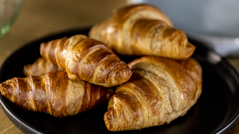 a plate of plain croissants