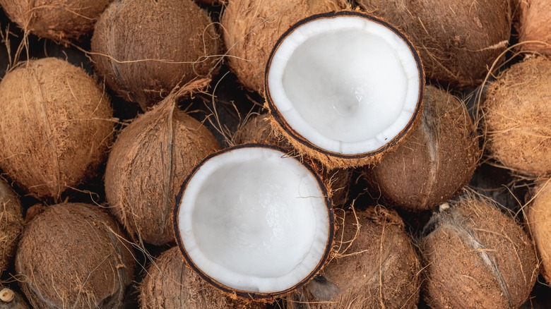 Whole and opened coconuts