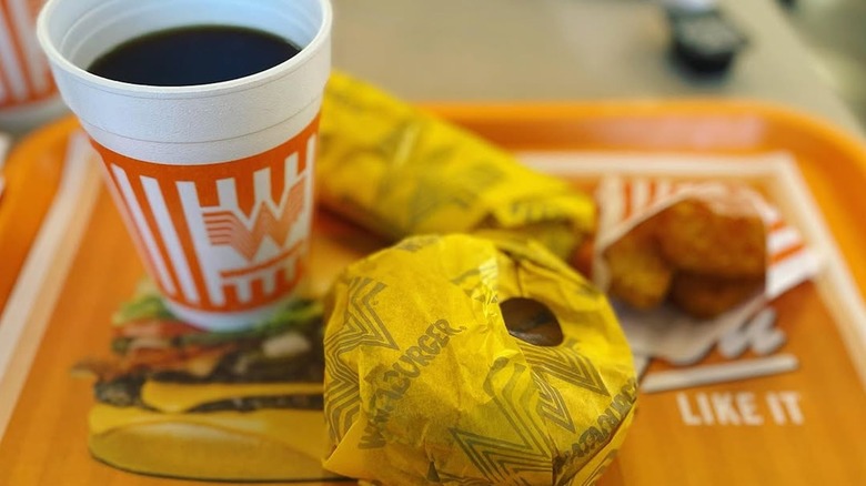 Whataburger breakfast with black coffee on a tray