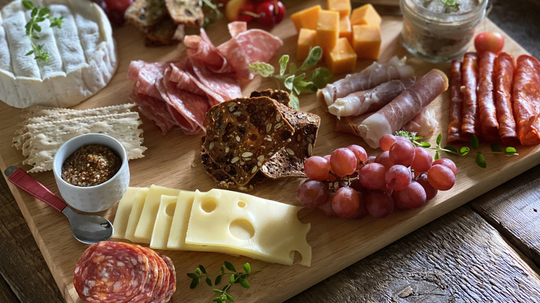 Charcuterie board with crackers and cheese