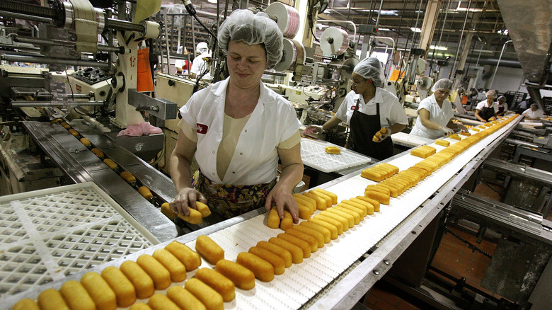 Workers operating on Twinkie assembly line