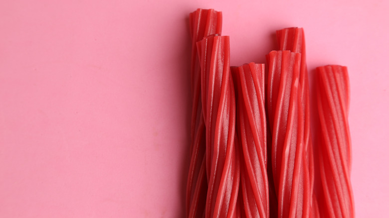 Close-up of Twizzlers against a pink background