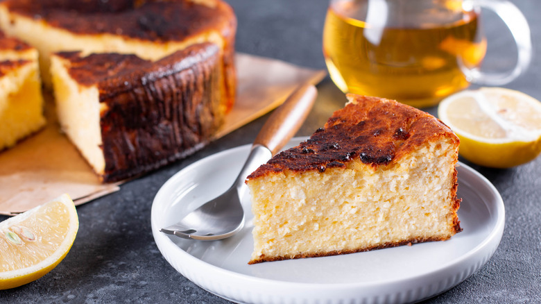 Basque cheesecake slice on a plate with a fork
