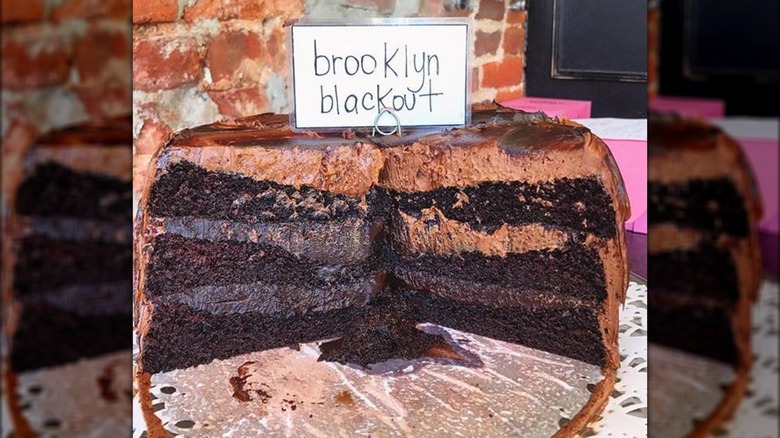 Brooklyn blackout cake with a sign in a bakery