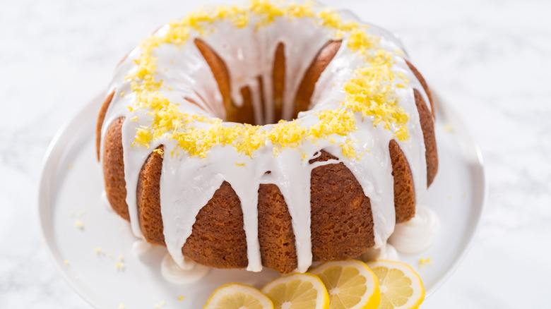 Lemon bundt cake on a white platter