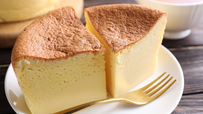 Puffy castella cake on a plate with a fork