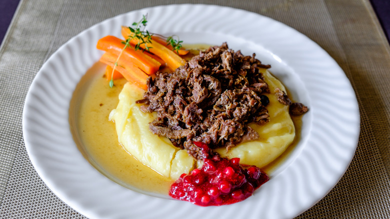 Caribou meat on mashed potatoes