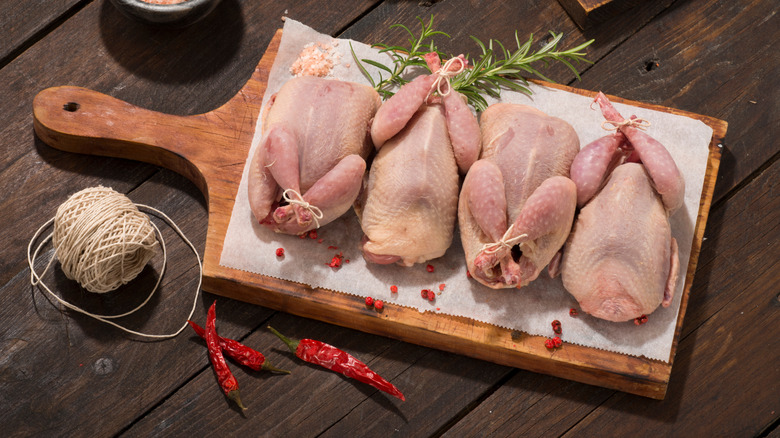 Quail on wooden board