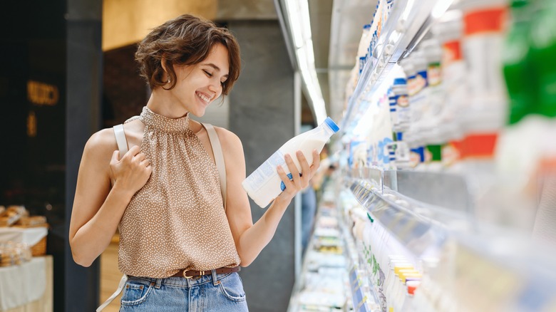 A woman who finds unusual bliss in examining a nutrition label.