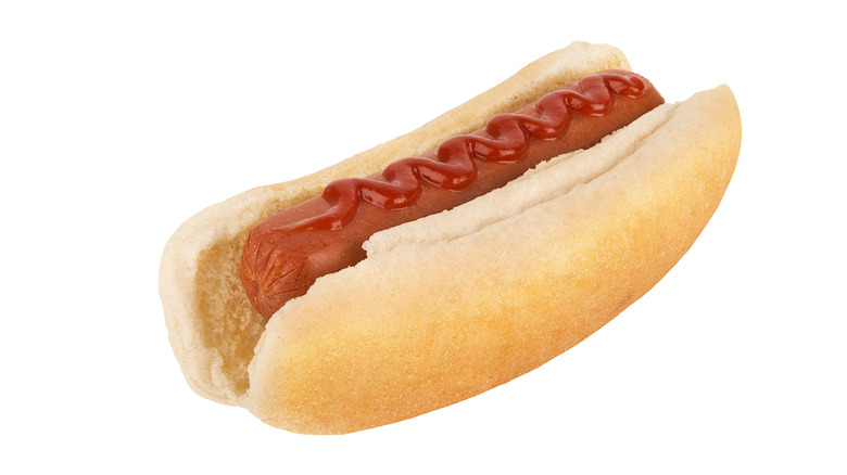Hot dog topped with ketchup