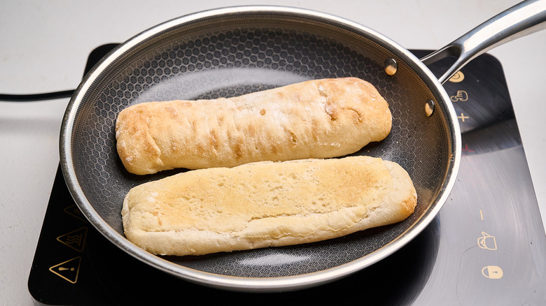 toasting bread in a skillet