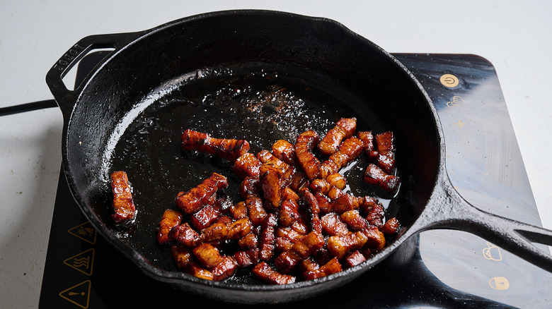 Cooking pork belly in a skillet
