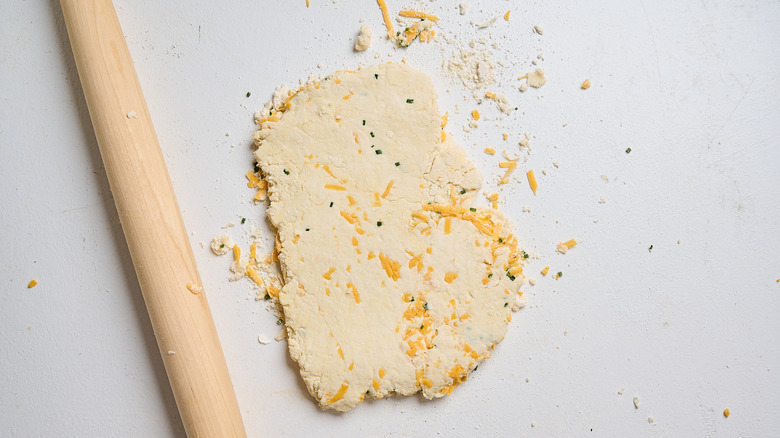 Rolling dough out on table