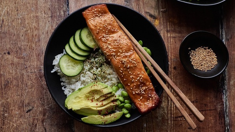 Rice bowl with miso-teriyaki salmon, avocado, and cucumber