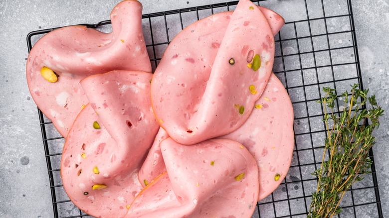 Sliced mortadella with thyme