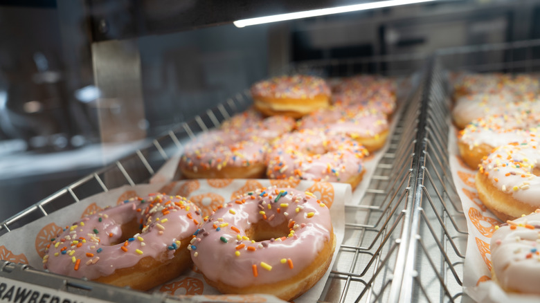 Dunkin' strawberry frosted donuts in serving tray
