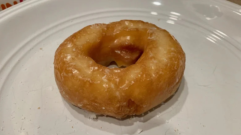 Sour cream donut on a white plate