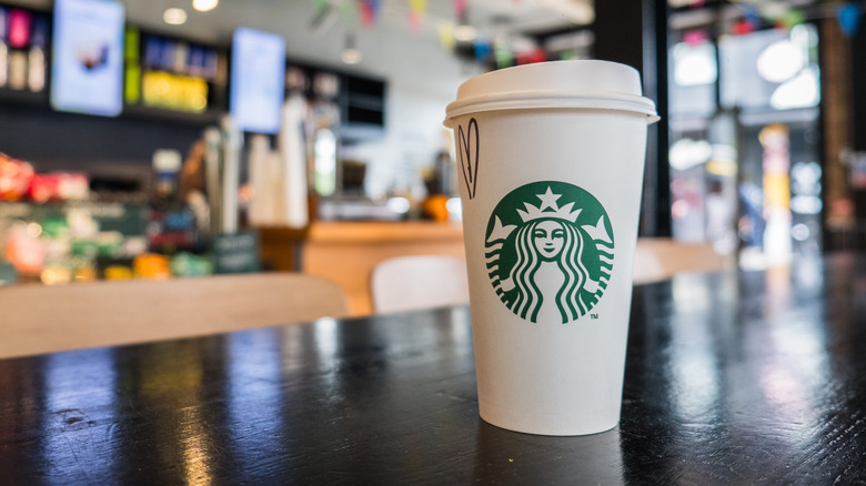 A hot Starbucks drink on a table