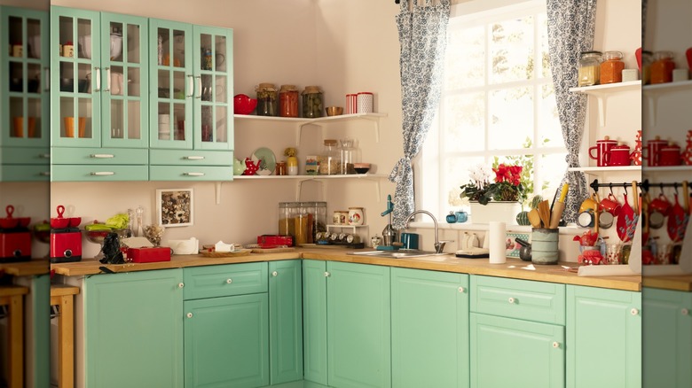 Vintage-styled kitchen with mint colored cabinets