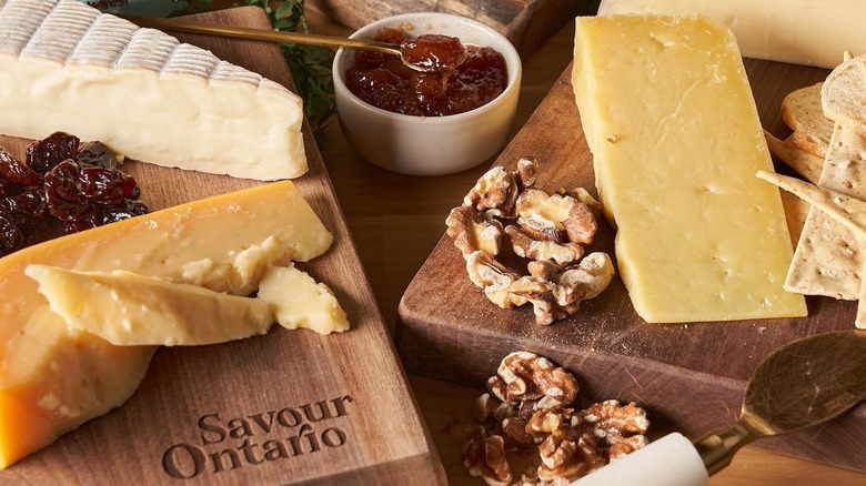 A board of artisan cheese from Ontario with jam and nuts