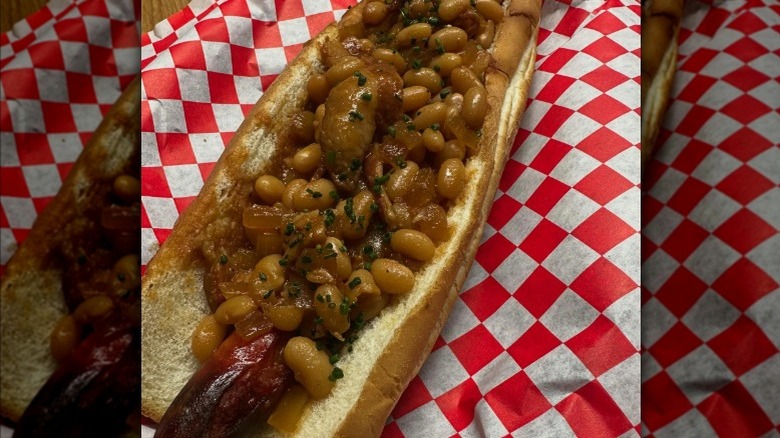 Hot dog with beans and bacon