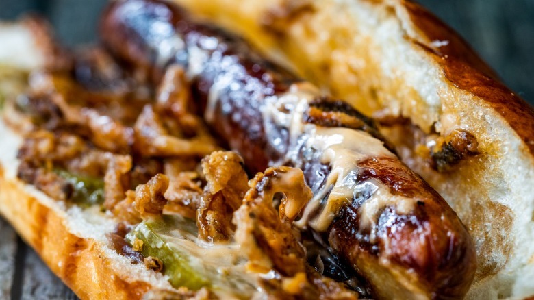 Hot dog with caramelized onions and cheese