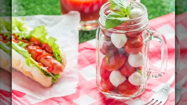 Hot dog with mozzarella and tomatoes