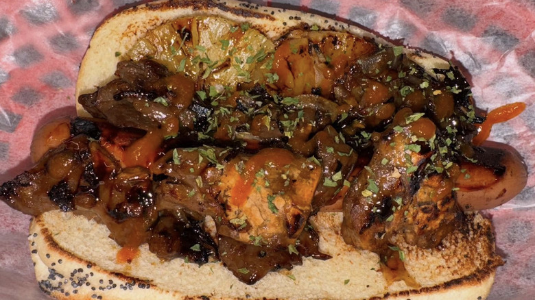 Pineapple and teriyaki sauce on a hot dog