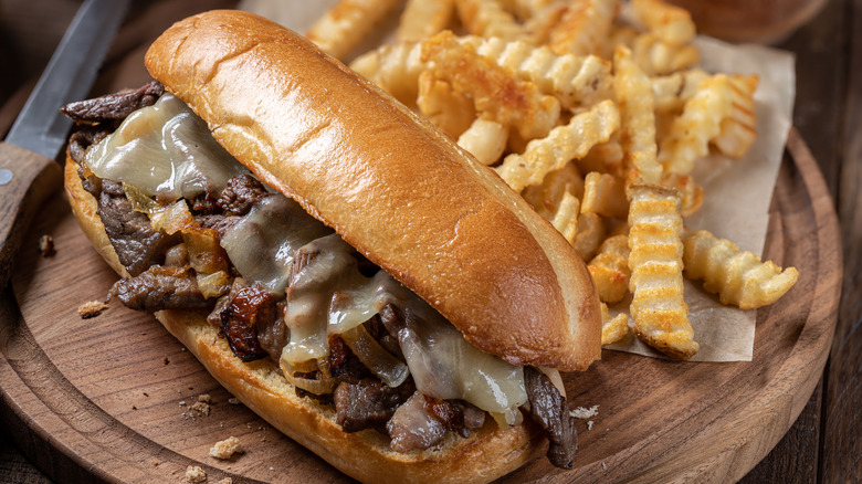 cheesesteak sandwich and fries