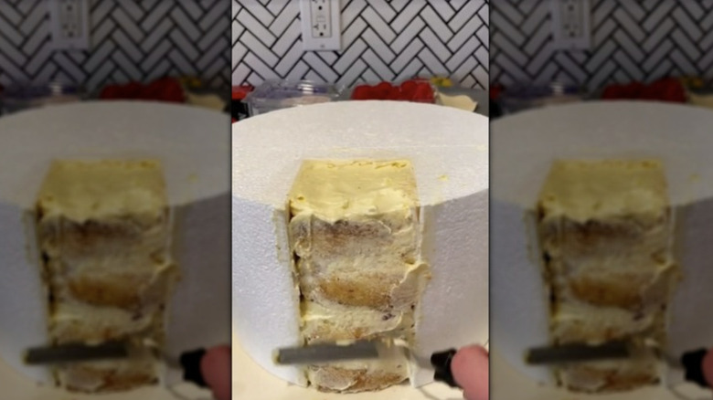 Dummy cake with section of real cake