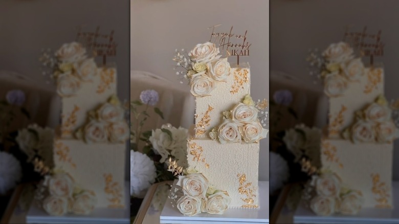 Square two-tier wedding cake with floral decorations
