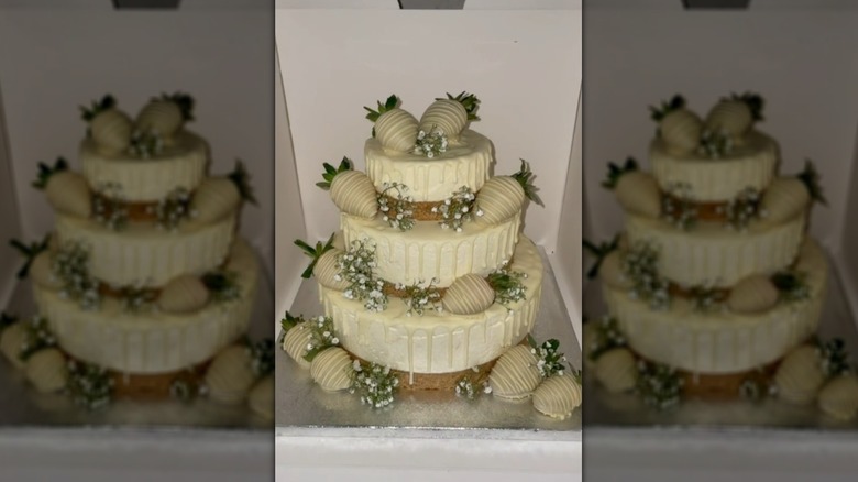 Wedding cheesecake decorated with white chocolate-covered strawberries