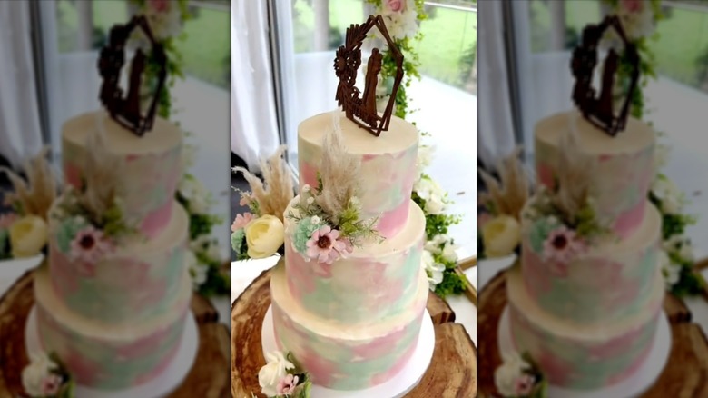 Pink and blue watercolor-style wedding cake