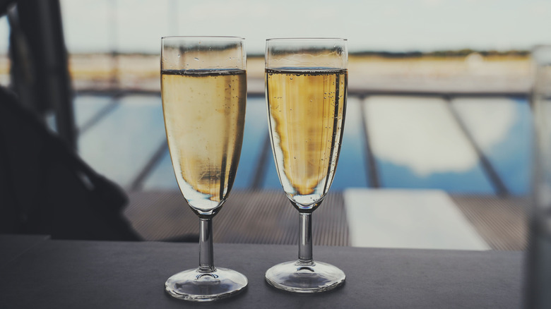 Two glasses of Prosecco at airport