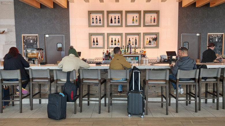 Customers at Louis Armstrong New Orleans International Airport bar