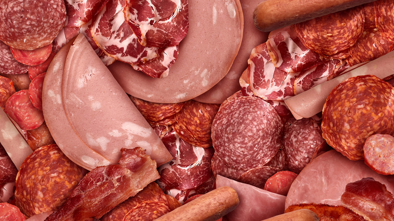 Variety of deli meats arranged on surface