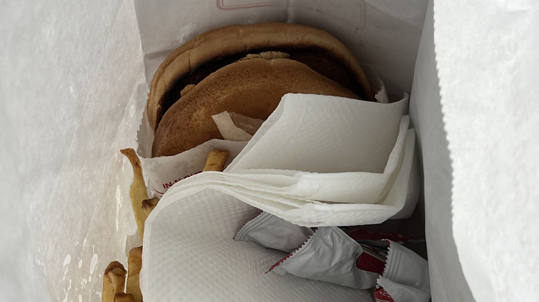 Top view of paper napkins and burger
