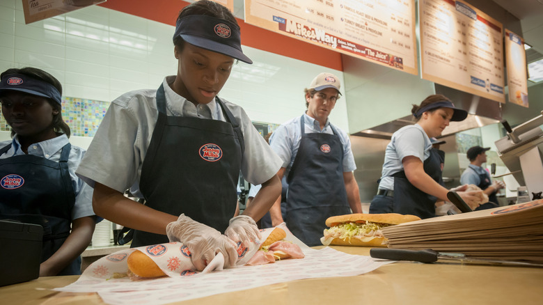 Employees making sandwiches at Jersey Mikes