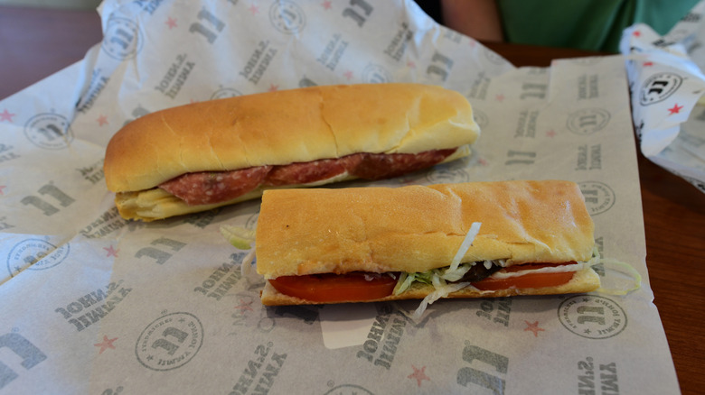 Two Jimmy Johns submarine sandwiches on paper