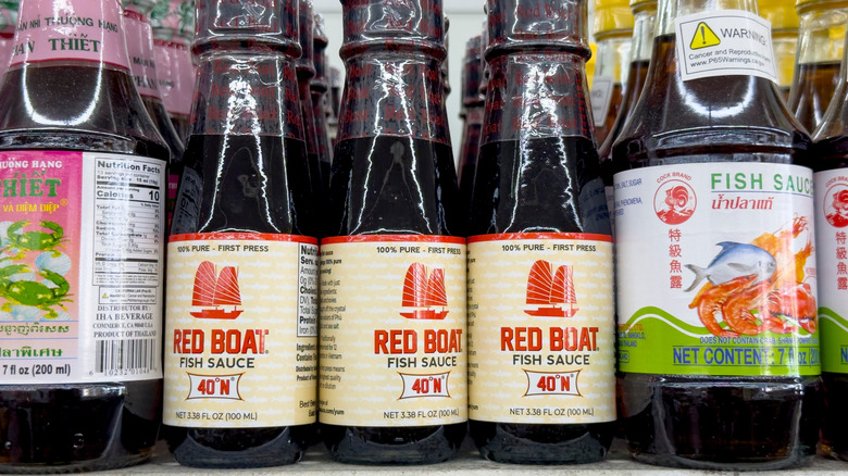 Bottles of fish sauce on grocery store shelf