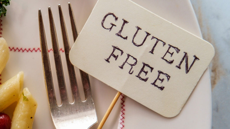 Gluten free sign next to fork on plate