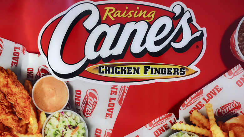 Raising Cane's sign with a chicken tenders meal