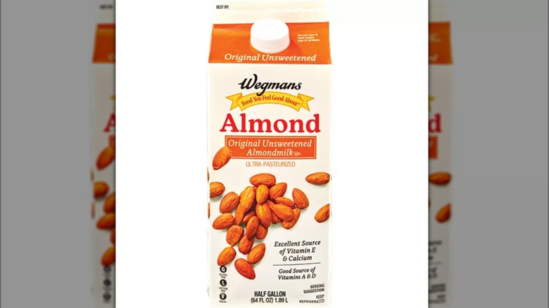 A carton of Wegmans unsweetened almond milk on a white background