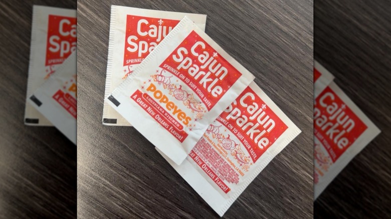 Small Cajun Sparkle packets on table