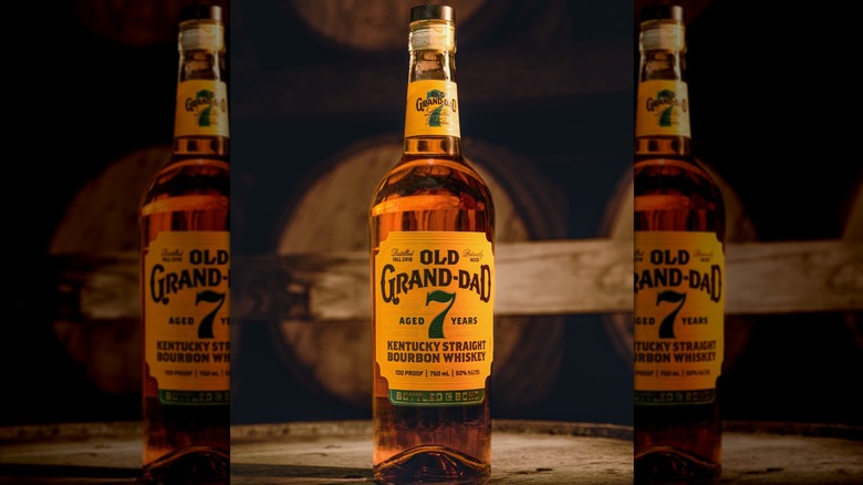 Bottle of Old Grand-Dad 7-year bourbon whiskey on barrel