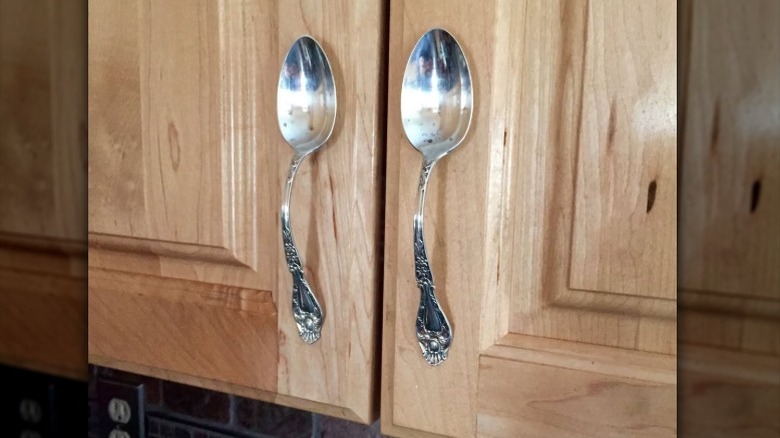 Antique spoons upcycled as cabinet handles