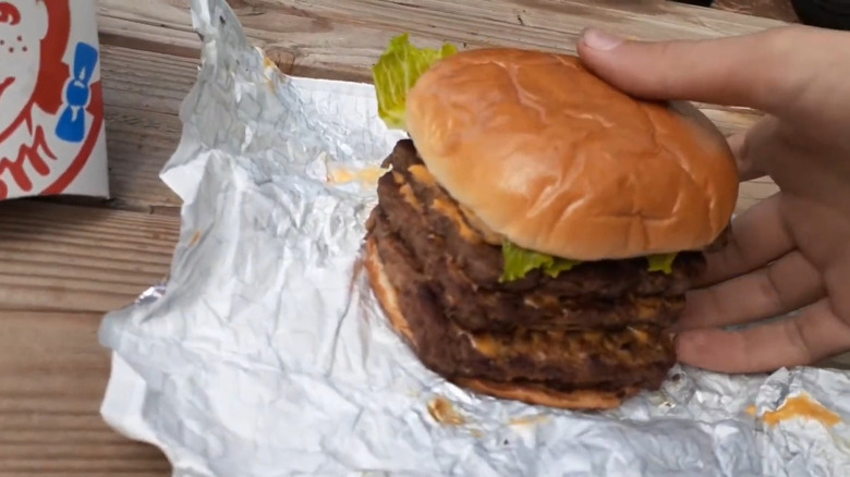An example of the Wendy's Meat Cube featuring four patties and toppings